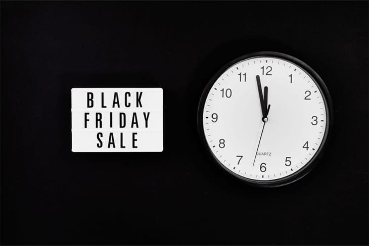 black Friday sign and a clock