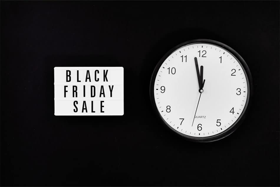 black Friday sign and a clock