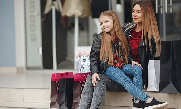 Mother and daughter taking a break during shopping
