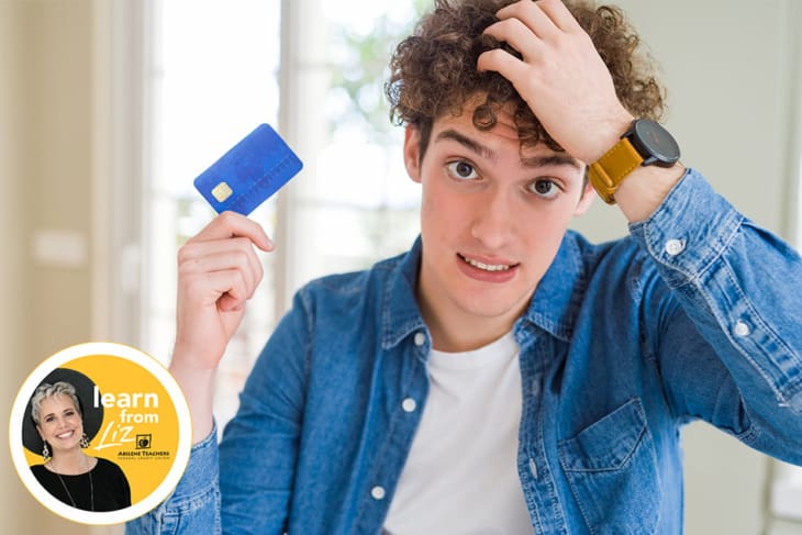 boy holding credit card with concerned face