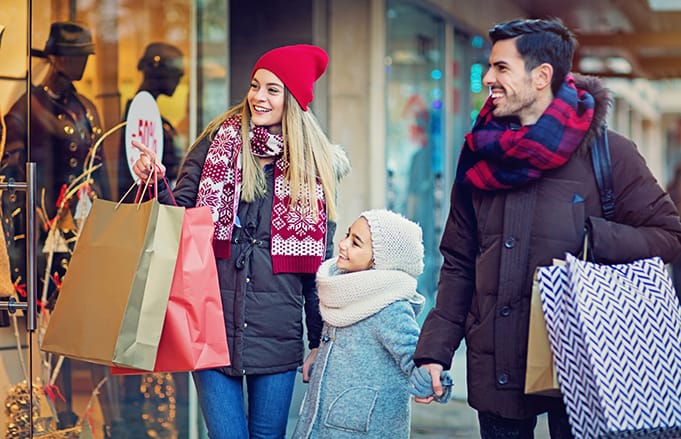 Young family Christmas shopping