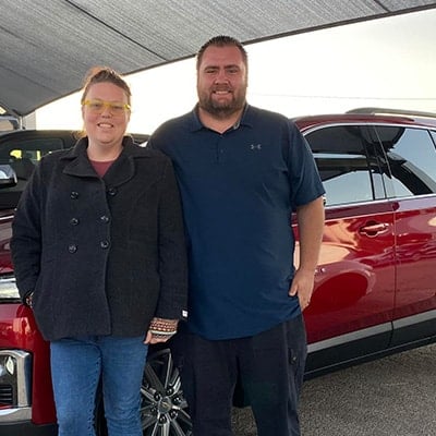 Picture of Gary Shipman and his wife with new car