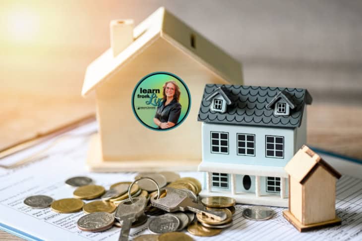 miniture homes with coin and keys on a contract