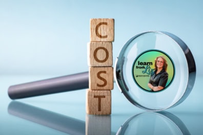 magnifying glass next to some blocks that spell out "Cost"