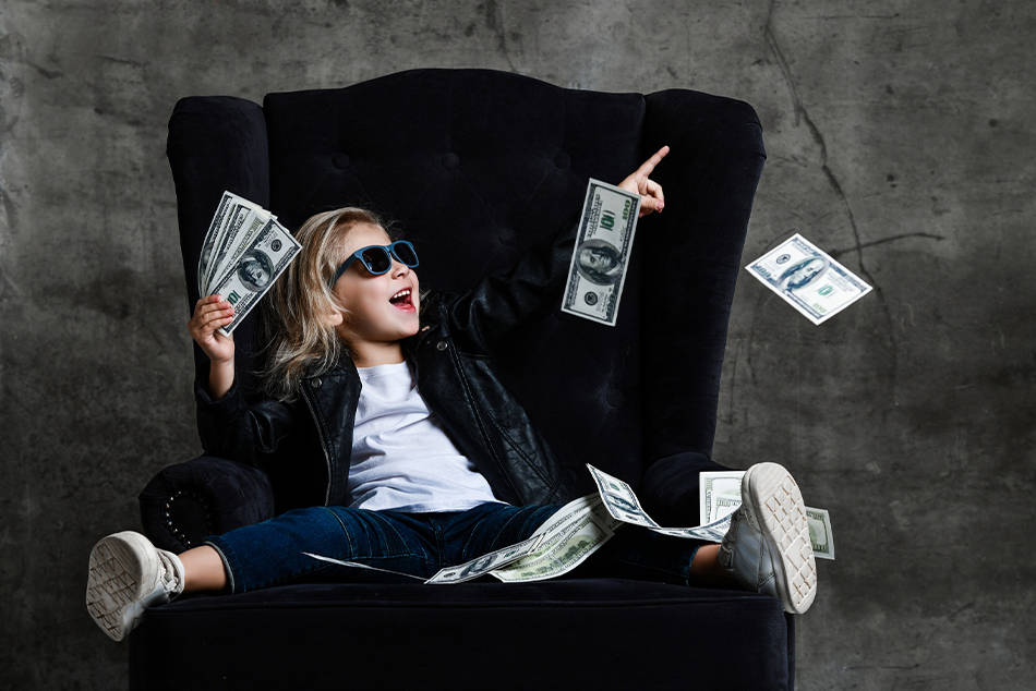 Young girl in velvet chair with play money