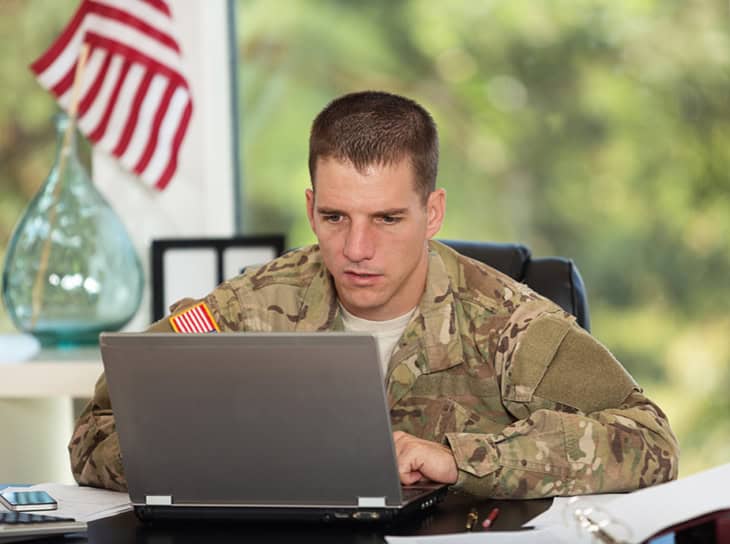 American soldier working on a laptop computer