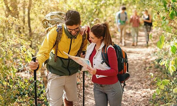 Hiking couple consulting a map