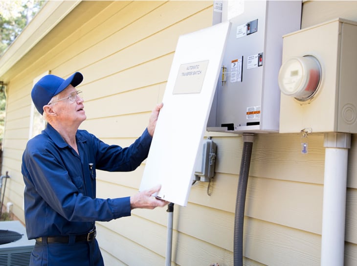 Sr adult air conditioner technician fixing outdoor AC unit