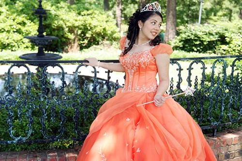 Young girl in orange formal dress