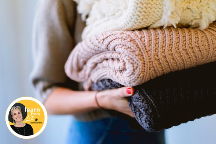 lady carrying blankets