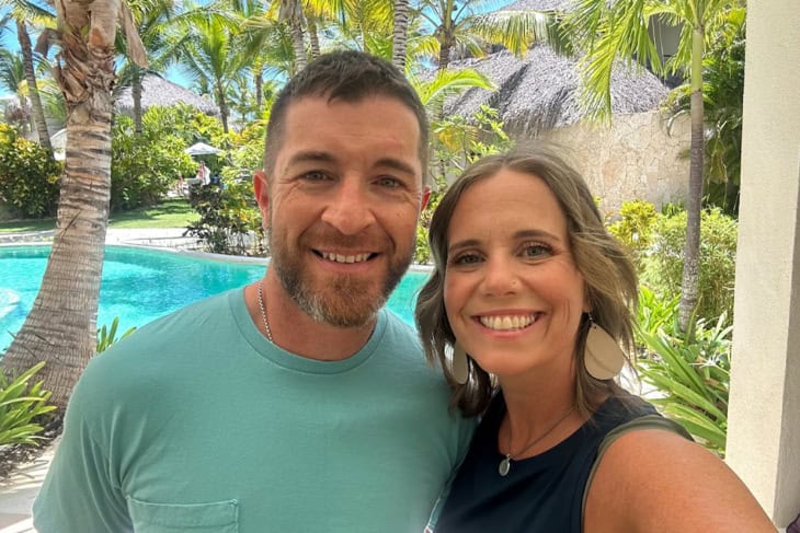 MAN AND WOMAN SMILING AT A RESORT