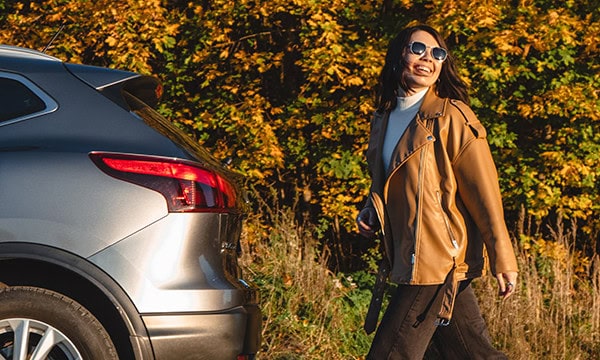 Young woman walking back to her car