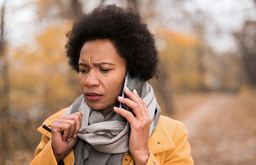 Worried woman on a mobile phone call