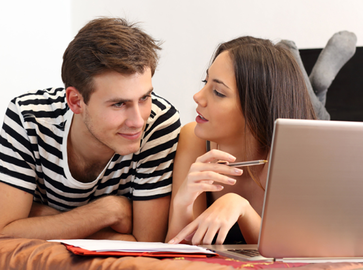 couple using laptop computer