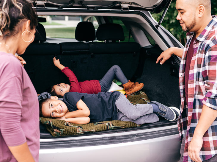 family playing in car