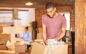 man unpacking boxes