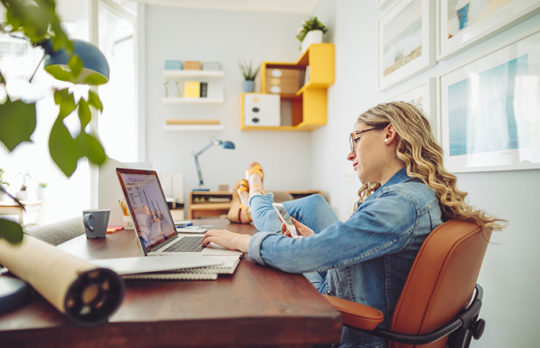 woman at computer relaxed