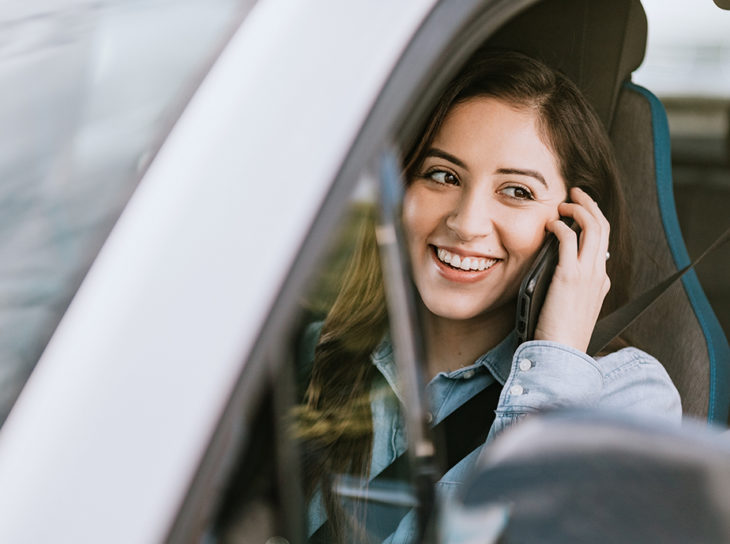 woman on phone in car