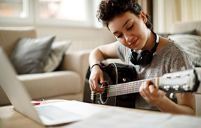 young woman playing guitar